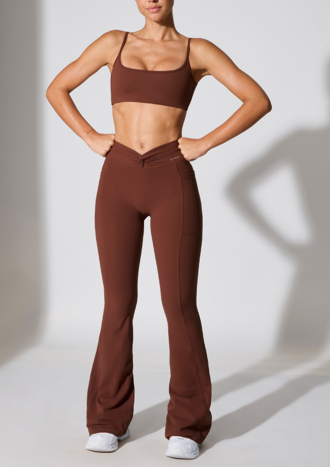 Iraida Twist Waist Flare pocket Leggings in Black